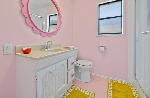 Lacy-Lakeview House | Rad, Pink A-Frame 10 min Magnolia + Baylor in Waco, TX