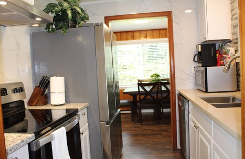 Federal Way House | Rare 1.5-acre gem—updated Home with Peaceful, private setting and serene.