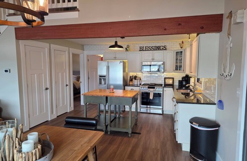 Sunrise Beach House | Rare level lot with boat launch on site. Wood burning fireplace. Dog friendly.