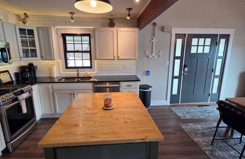 Sunrise Beach House | Rare level lot with boat launch on site. Wood burning fireplace. Dog friendly.