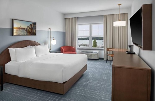 Canandaigua Hotel | Refined Retreat by the Lake with Pool, Outdoor Seating, and Serene Atmosphere