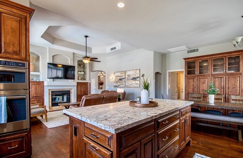 Mountain Park Ranch House | Relax and recharge at this stylish desert retreat with views of rolling desert hills. Enjoy sunsets from the heated pool, dine outdoors, or unwind with a few on the putting green. Perfect for long stays—just 15 minutes from the airport!