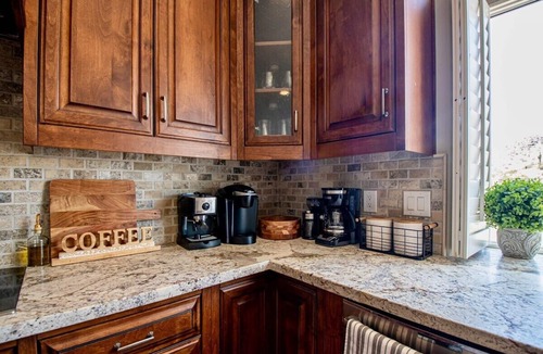 Mountain Park Ranch House | Relax and recharge at this stylish desert retreat with views of rolling desert hills. Enjoy sunsets from the heated pool, dine outdoors, or unwind with a few on the putting green. Perfect for long stays—just 15 minutes from the airport!
