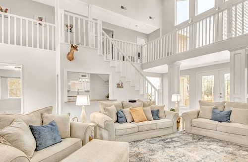 Seven Coves House | Relax and unwind on the deck with water view of Lake Conroe