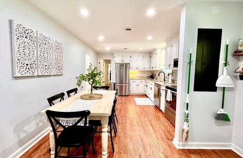 North Chesterfield Cottage | Relax at Crieff Cottage, a cozy 3-bedroom Richmond retreat with a private hot tub, two king bedrooms, inviting living spaces, and a stocked kitchen. Quiet location with easy access to downtown, restaurants, hospitals, and universities.