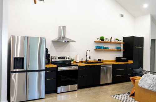 Forestburg House | Relax at this Modern Rustic Barndominium in Nocona. This 2BR, 2BA retreat offers an open layout, chef’s kitchen, spa-style baths, and outdoor patio with fire pit—perfect for families, couples, or friends under the Texas stars.
