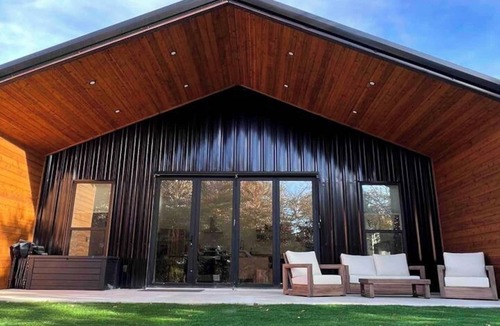 Forestburg House | Relax at this Modern Rustic Barndominium in Nocona. This 2BR, 2BA retreat offers an open layout, chef’s kitchen, spa-style baths, and outdoor patio with fire pit—perfect for families, couples, or friends under the Texas stars.
