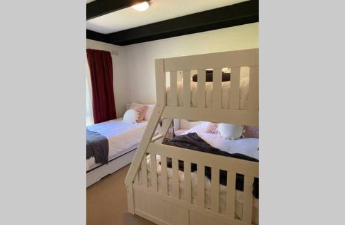 Goughs Bay House | Relax in the spa with views opposite Lake Eildon