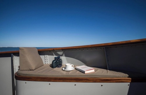 Sant Carles de la Rapita Boat Rental | Relax on a stunning classic motor yacht in a soothing waterfront setting