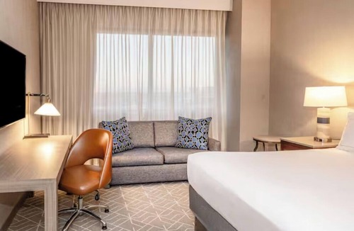 Richardson Hotel | Relax, Swim & Recharge: Hotel-Style Stay with Pool & 24-hour Fitness Center