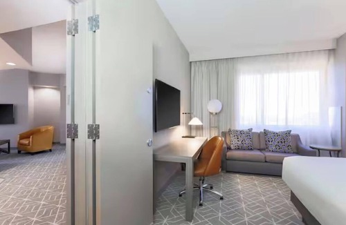 Richardson Hotel | Relax, Swim & Recharge: Hotel-Style Stay with Pool & 24-hour Fitness Center