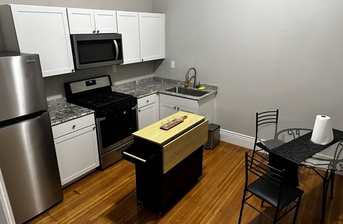 Oswego Apartment | Remodeled Historical Mansion Minutes from Oswego’s Best!