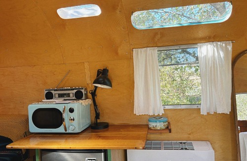 Oklahoma City House | Renovated 1976 Airstream Argosy, A Wooded Retreat in Oklahoma City