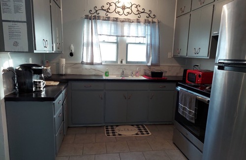 Iola House | Renovated Bungalow with Cozy Gas Fireplace