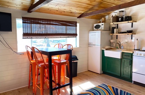 Camdenton Cabin | Renovated lakeside cabin with pool & resort amenities!