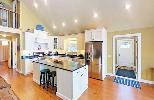 Lamoine Beach Cabin | Renovated waterfront cottage with expansive deck, multiple fireplaces, & grill
