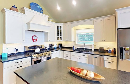 Lamoine Beach Cabin | Renovated waterfront cottage with expansive deck, multiple fireplaces, & grill