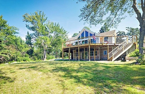 Lamoine Beach Cabin | Renovated waterfront cottage with expansive deck, multiple fireplaces, & grill