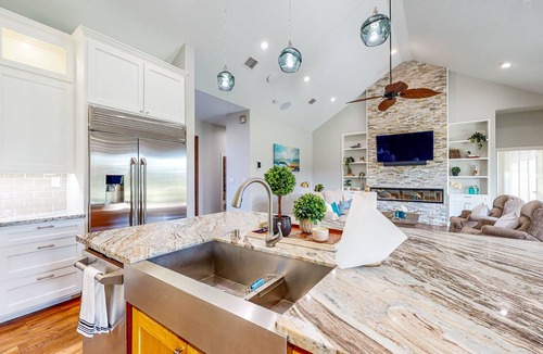 Waller House | Resort-Style Oasis with Swimming Pond, Beach, Tropical Hut & Bar