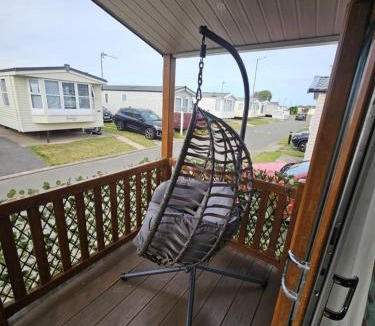 Rhyl House | Rhyl Caravan with Veranda Egg Chairs & Garden