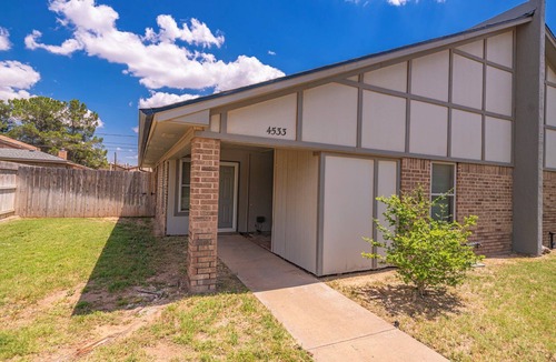 Midland House | Right at Home-Uptown Place with gated yard and covered parking