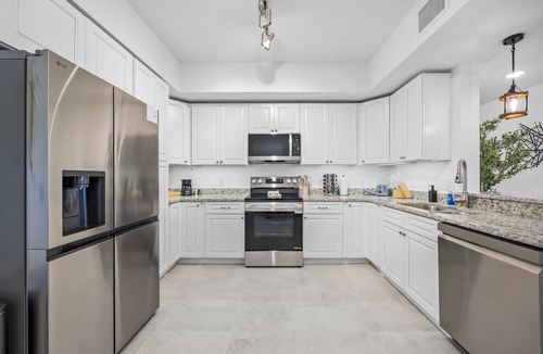Merritt Island Condo | River Fly-In Duo - 4Bd - Garden View