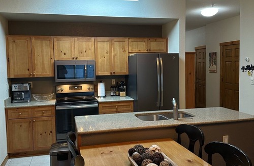 Lakeside Village Condo | River front w fireplace, hot tub bus stop at door, convenient & private
