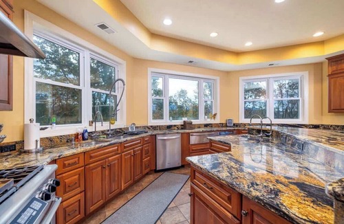 Bentonville House | Riverbend Lodge Spacious Riverfront Home with Hot Tub, Pool & Mountain view