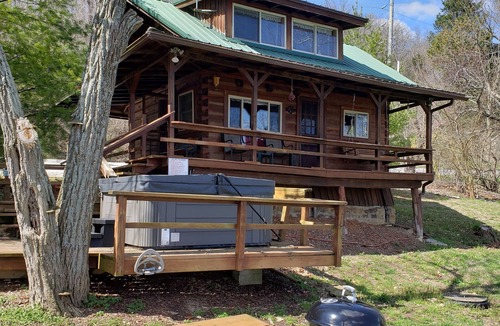 Derby Cabin | Riverfront Cabin with hot tub