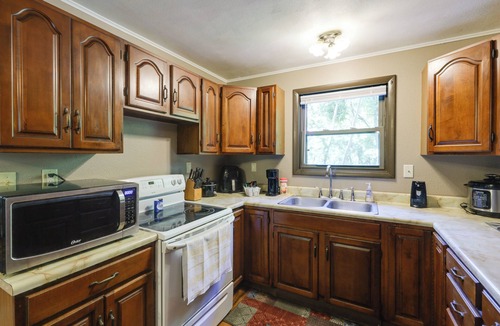 Covington Cottage | Riverfront Covington Cabin w/Deck & Fire Pit!