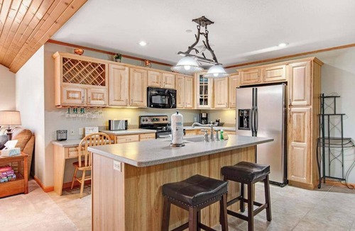 Arkdale Condo | Riverfront golf resort condo with pool, hot tub, volleyball, & fairway-view deck