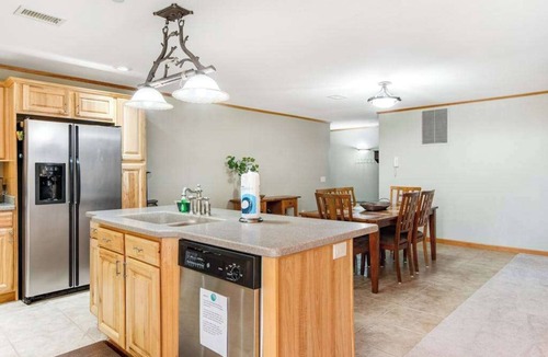 Arkdale Condo | Riverfront golf resort condo with pool, hot tub, volleyball, & fairway-view deck