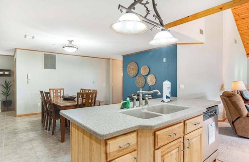 Arkdale Condo | Riverfront golf resort condo with pool, hot tub, volleyball, & fairway-view deck