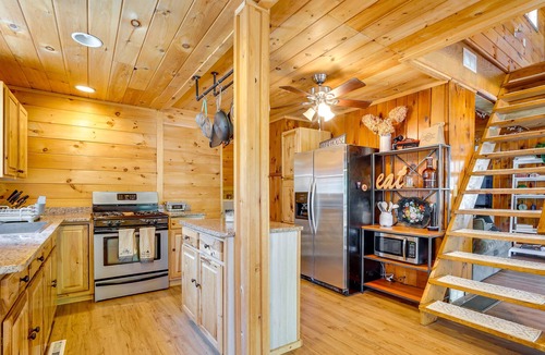 Lake Luzerne-Hadley Cottage | Riverfront Hadley Getaway w/ Fire Pit & Boat Dock!