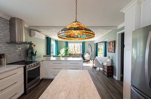 Milton House | Riverfront Home with Outdoor Living Spaces and Hot Tub