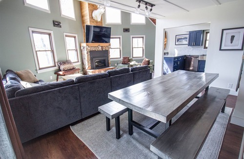 Reed City Ski Chalet | Riverfront | Hot Tub, Fireplace, Kayaks & Tubes