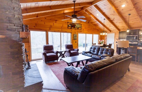 Evart Cabin | Riverfront | Hot Tub, Fireplace, Kayaks & Tubes