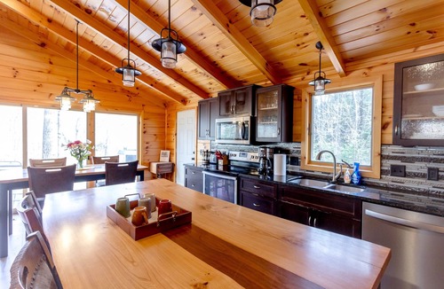 Evart Cabin | Riverfront | Hot Tub, Fireplace, Kayaks & Tubes