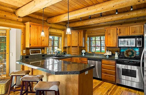 Three Rivers House | Riverfront log cabin style home with full kitchen, deck, washer & dryer and WIFI