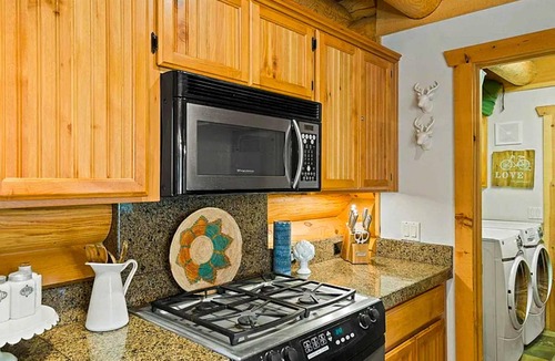 Three Rivers House | Riverfront log cabin style home with full kitchen, deck, washer & dryer and WIFI