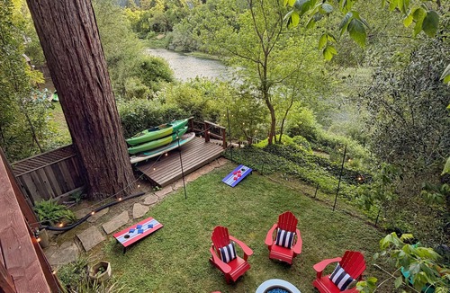 Northwood Cabin | Riverfront luxury cabin, hot tub, private dock, redwoods, ping-pong, foosball