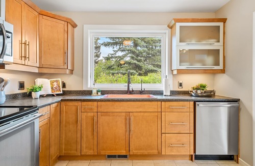 Northwest Calgary House | Riverfront Oasis on Calgary’s Best Street