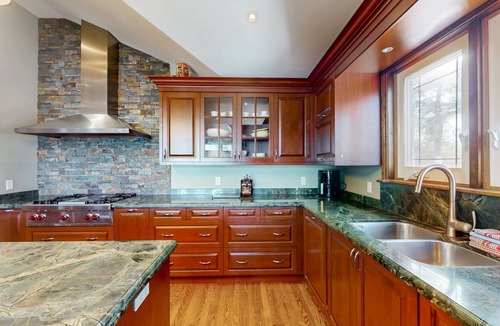 Wasaga Beach House | Riverfront retreat with seasonal heated pool, beach access, jetted tub & firepit