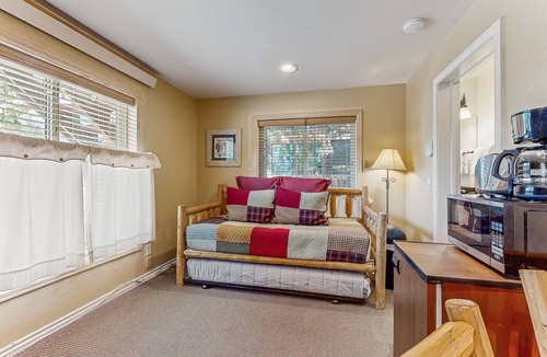 Grand Lake Condo | Riverfront retreat with a kitchenette, washer/dryer, & shared patio