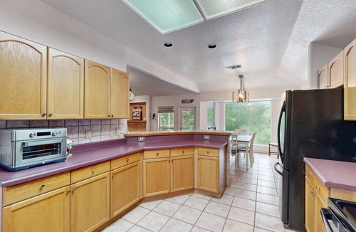 Seguin House | Riverfront retreat w/wraparound deck, gas grill, free WiFi, & central AC