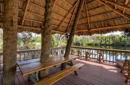 Braden River House | Riverside Oasis Home w Tiki Hut & Firepit