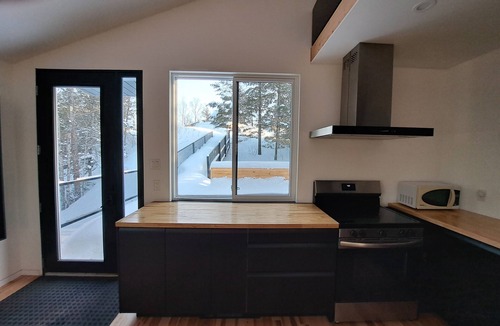 Harrington Ski Chalet | Rock House -Beautiful Architecture in the trees nestled between two lakes
