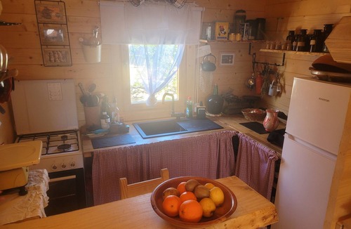 Costa Dorada Ski Chalet | Romantic chalet with private pool surrounded by olive trees.