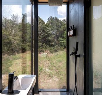 Bastrop House | Romantic Mirror Cabin Retreat by the Lake in the Enchanted Forests of Texas