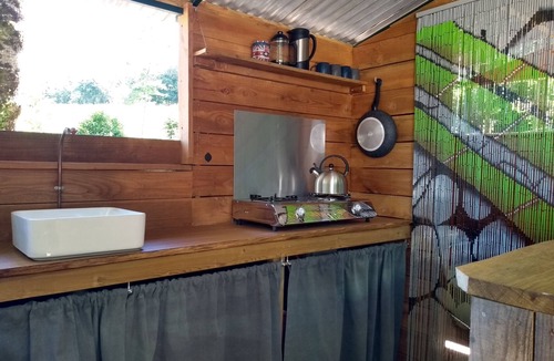 Busserolles Cabin | Romantic riverfront shepherds' hut with outdoor kitchen w/firepit